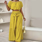 Ensemble deux pièces haut épaules nues à manches bouffantes et pantalon large – Élégant, confortable et parfait pour les journées d’été ☀️