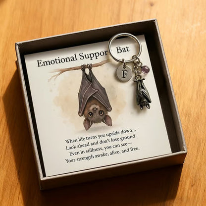 Porte-clés chauve-souris offrant un soutien émotionnel et une carte avec un message